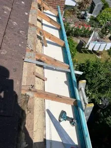 Installation of new uPVC fascia boards on a residential roofline