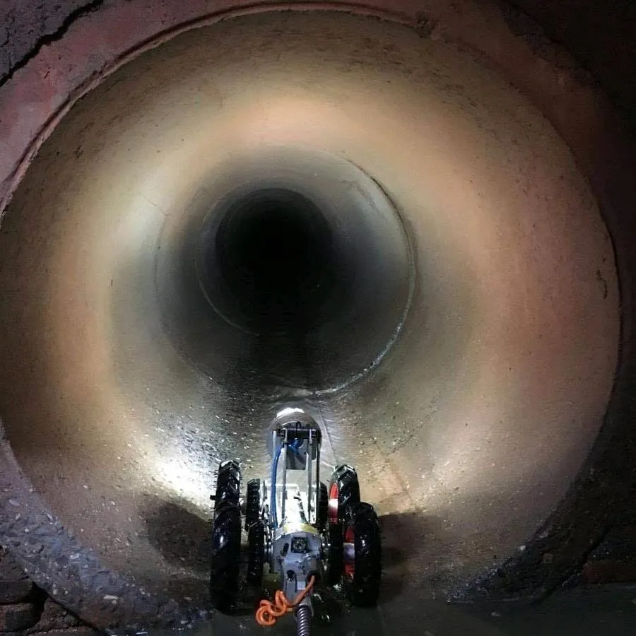 CCTV drain camera robot inspecting a large sewer pipe