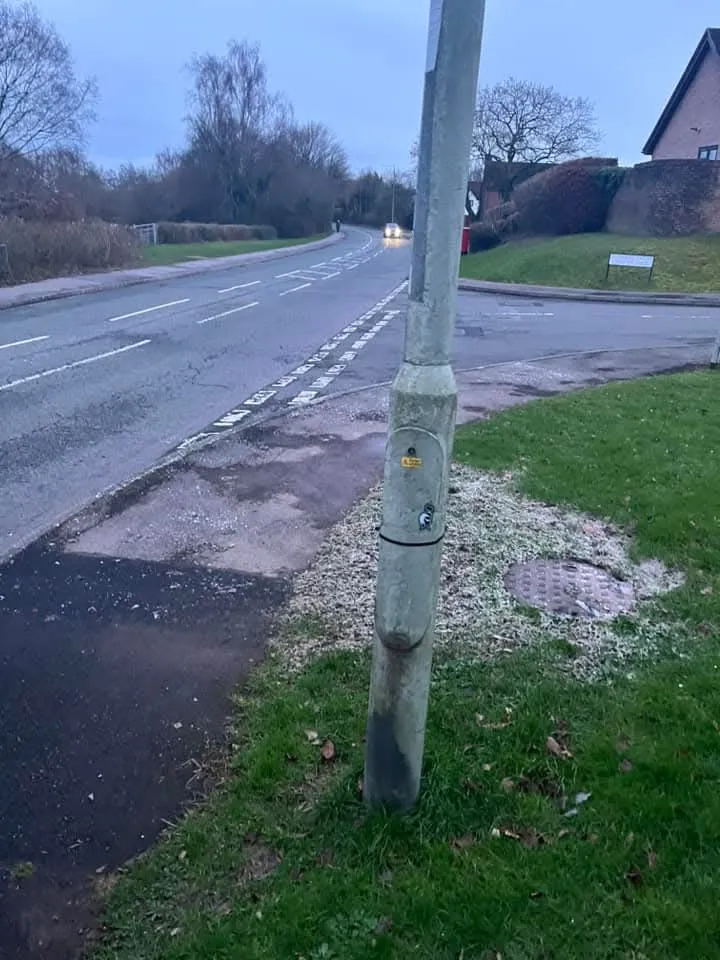 Outdoor manhole cover on grass verge