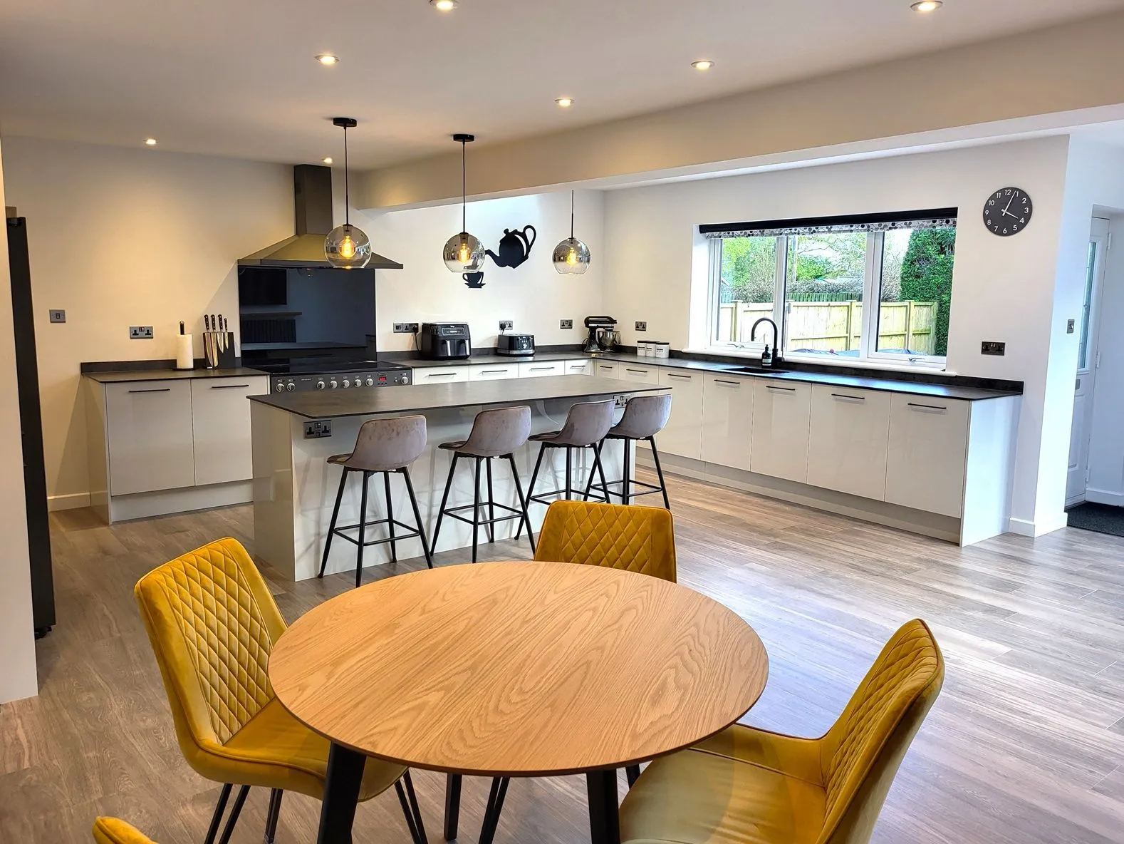 Modern kitchen and dining space renovation by DP Carpentry & Building LTD in Gloucestershire