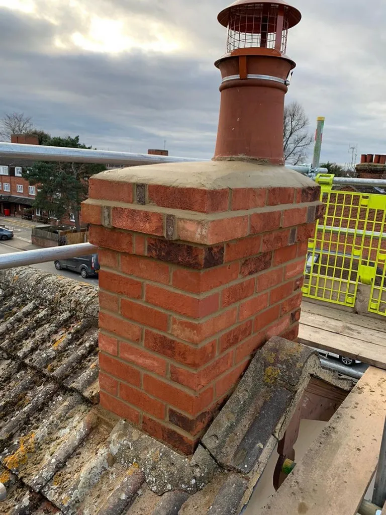 Expert chimney repointing and repair work on a tiled roof