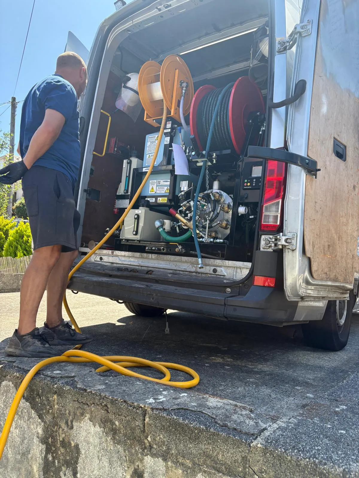 Drains2Flow engineer preparing high-pressure drain jetting equipment for unblocking services.