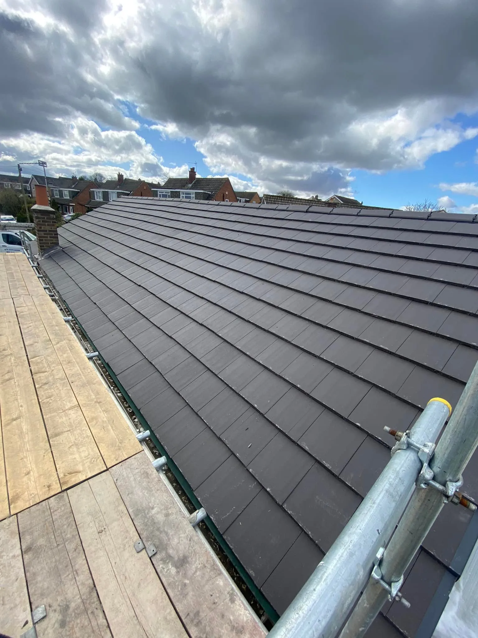 Newly installed dark grey concrete tiled pitched roof