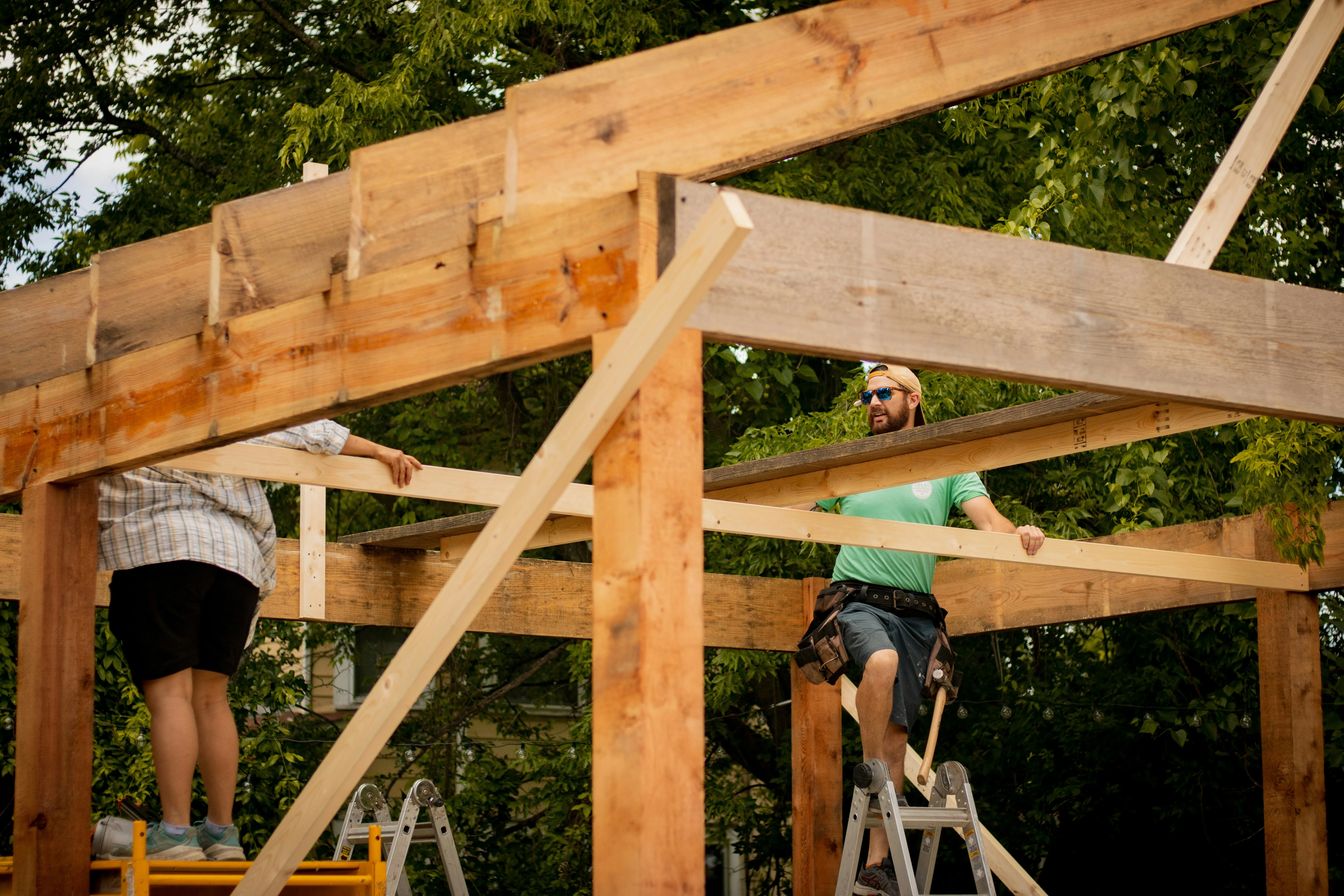Roofers from Foster and Son building the timber framework for a new pitched roof or conservatory conversion.