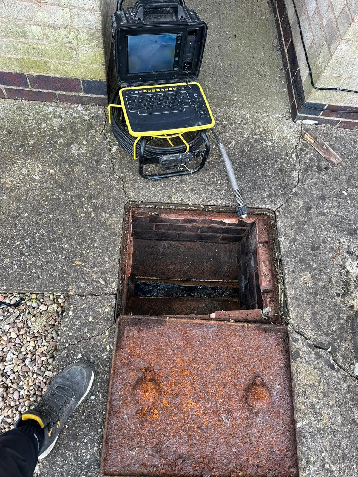 CCTV drain survey equipment inspecting a manhole for drainage issues in Devon
