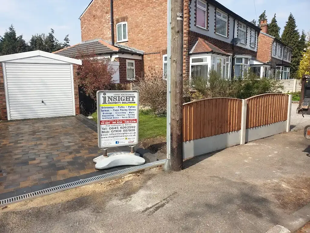 Completed block paved driveway and new garden fencing at a house
