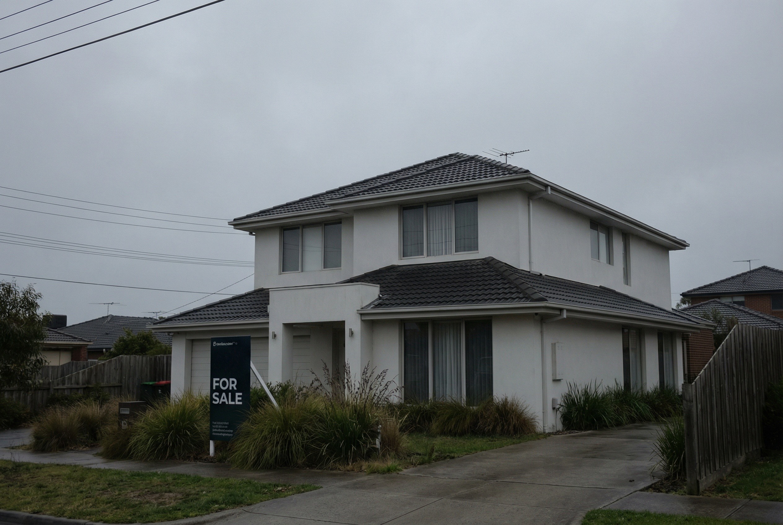 Property exterior with grey overcast sky