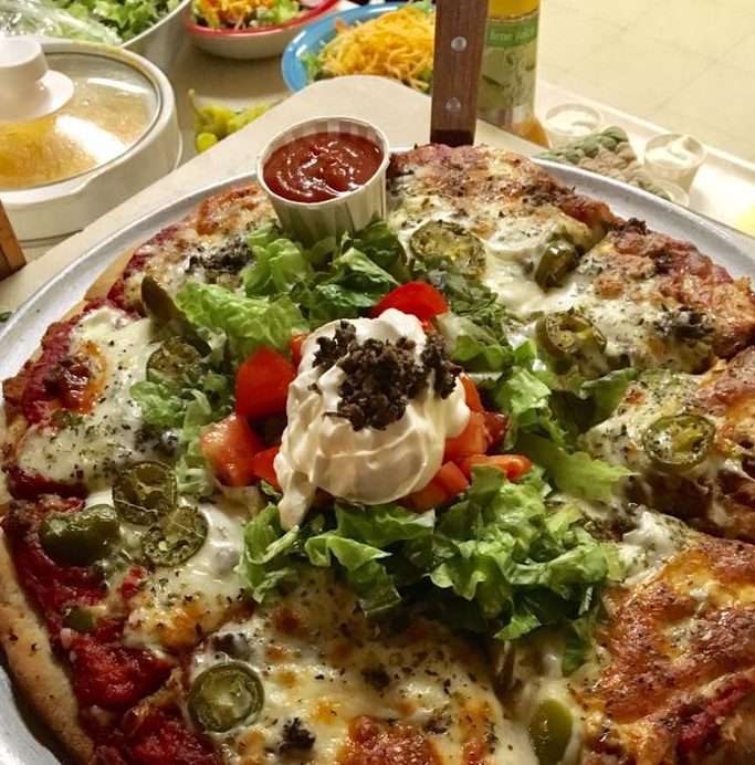 A loaded pizza from the Butchies kitchen