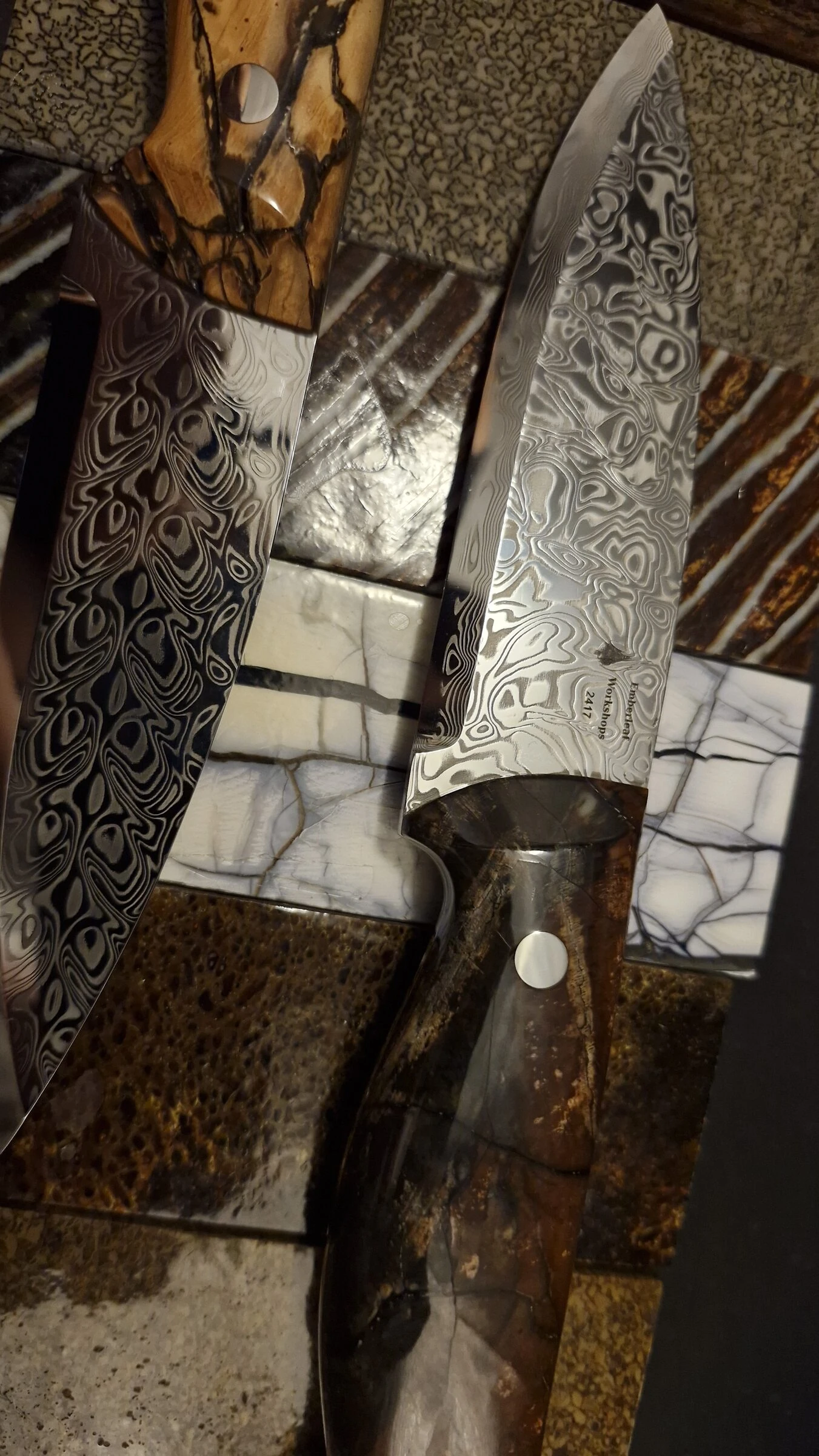 Knife 2417 full length, overhead on patterned handle-material tiles