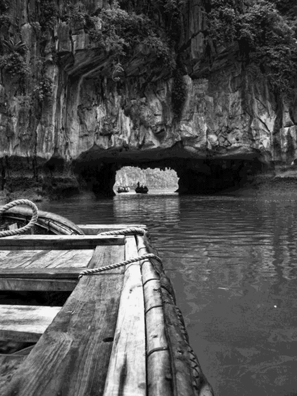 Boat sailing through a cave entrance for Other e-reader wallpaper or screensaver featuring boat and cave and more