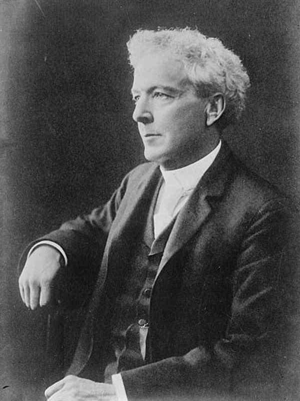 Portrait of a man in a suit and clerical collar for Other e-reader wallpaper or screensaver featuring portrait and man and more
