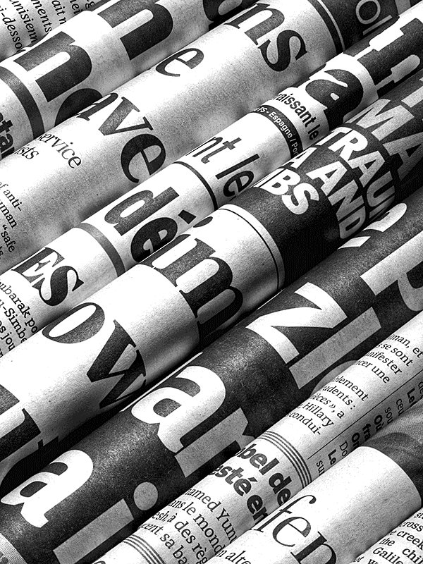 Rolled newspapers close-up for Other e-reader wallpaper or screensaver featuring news and print and more