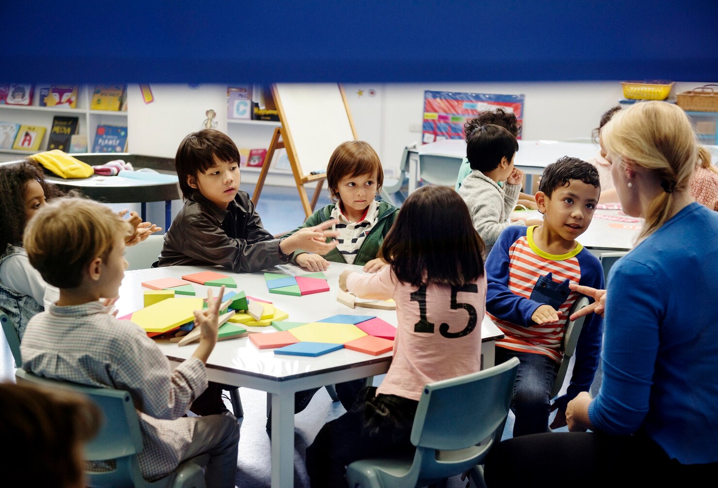 A vibrant Canadian classroom with students collaborating on a group project.