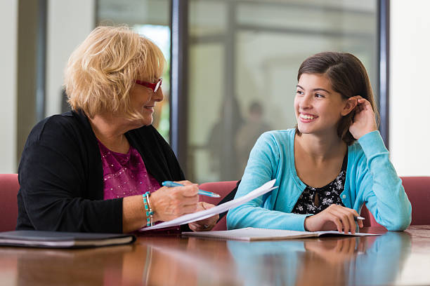 Mentor guiding a student on applying for study abroad scholarships and financial aid.