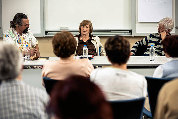 Local school board members, teachers, and parents engaged in a discussion about education policies in a U.S. school district.