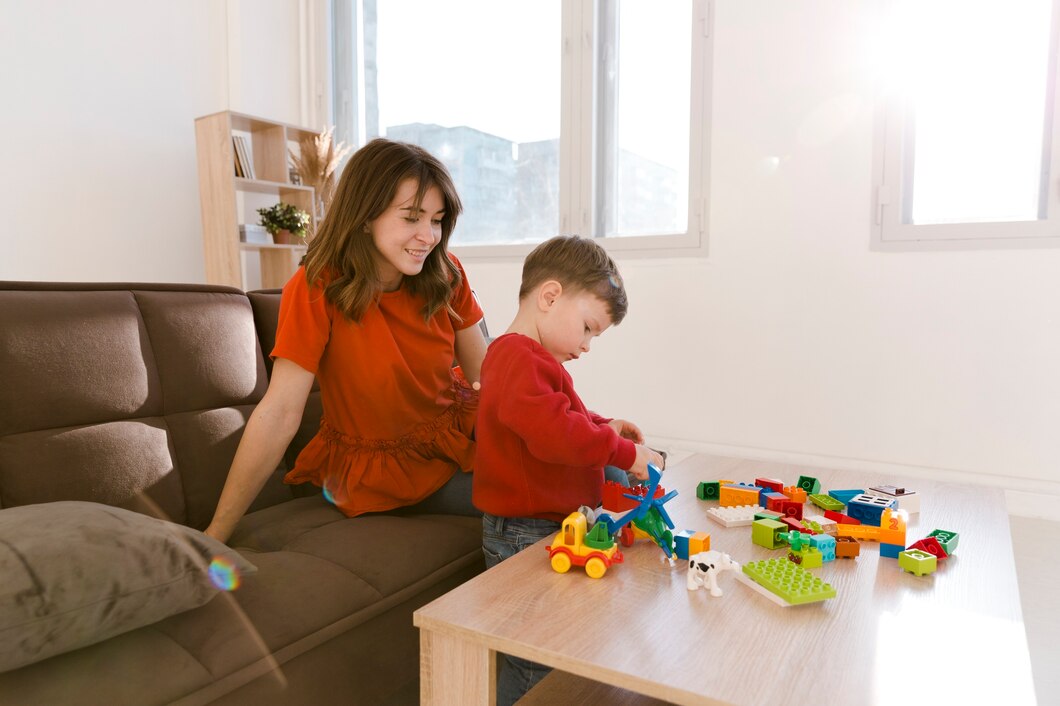 A mother observing her young child building with colorful blocks, symbolizing the observation stage of a career plan by identifying strengths and interests.