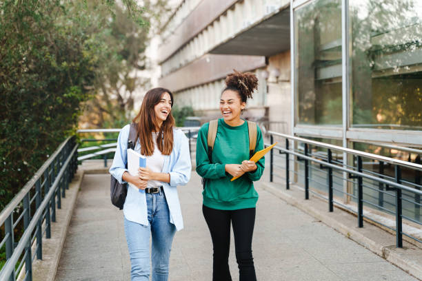 Students walking through a UK university campus, representing higher education opportunities.