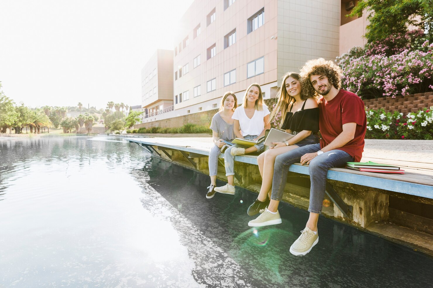 A scenic view of a Canadian university campus with students studying.