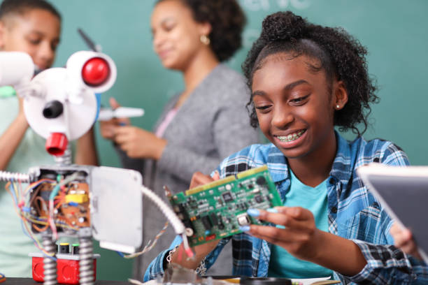 A student engaging with robotics, highlighting the importance of preparing for future careers in technology.