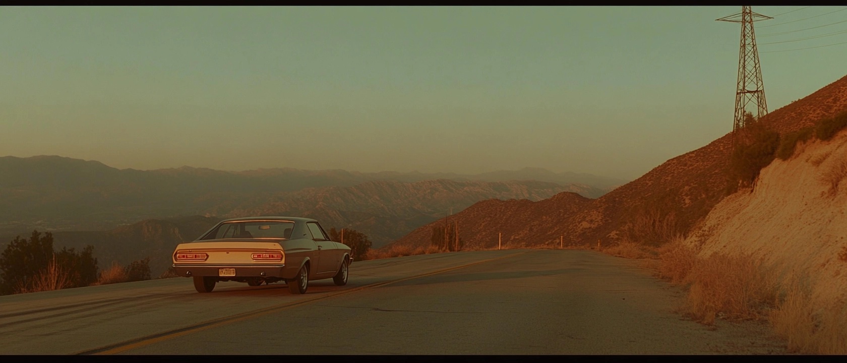 A vintage car parked on a winding road that cuts through a mountainous landscape during sunset. The warm hues of the fading light cast a serene glow over the mountains and the road, enhancing the feeling of solitude and exploration. The scene evokes a sense of nostalgia and adventure, perfectly capturing a moment of journey and reflection in nature's beauty.