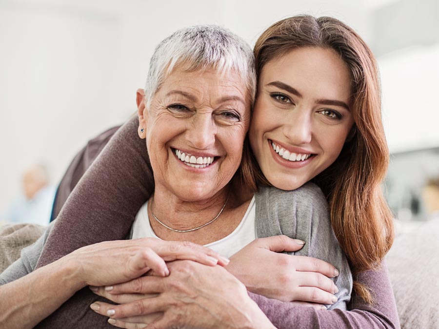smiling woman and old woman
