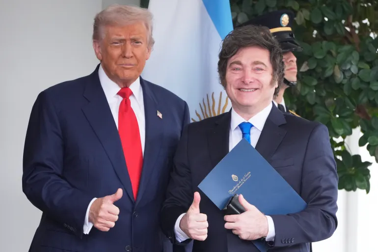 President Donald Trump greets Argentina's President Javier Milei, as he arrives at the White House, on Tuesday, October 14, 2025, in Washington, DC
