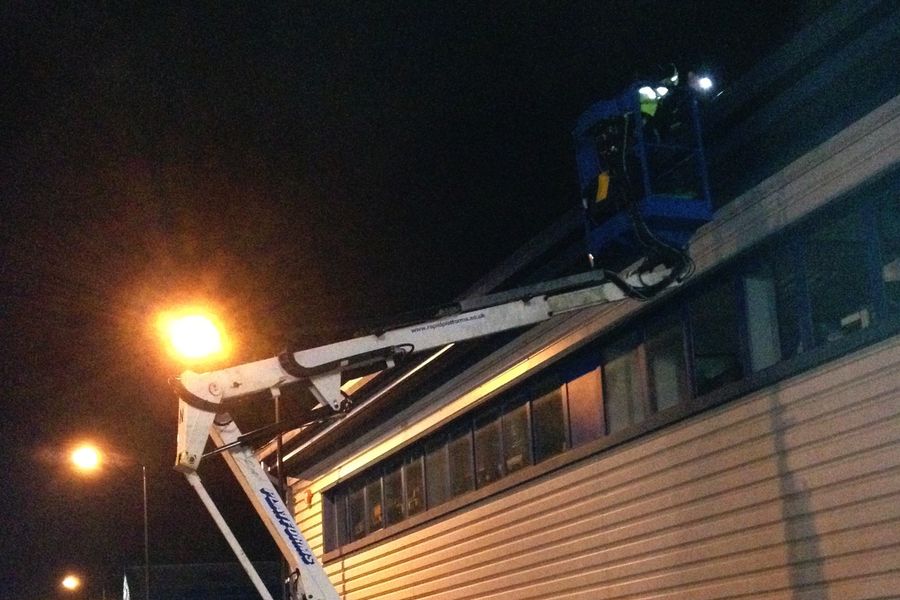 Gutter cleaning at night.