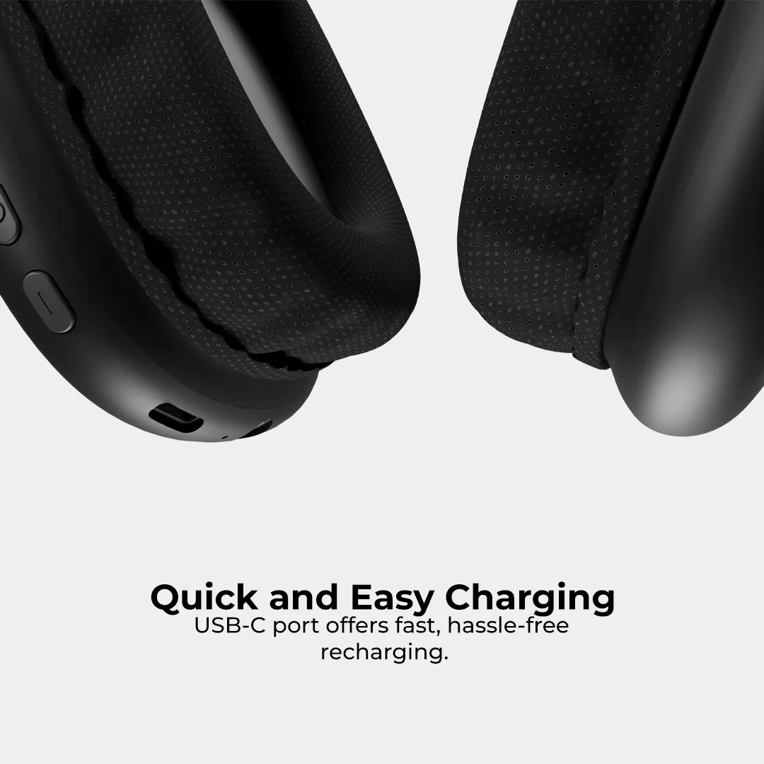 Boost Pulse Bluetooth Earphones resting beside a laptop on a desk