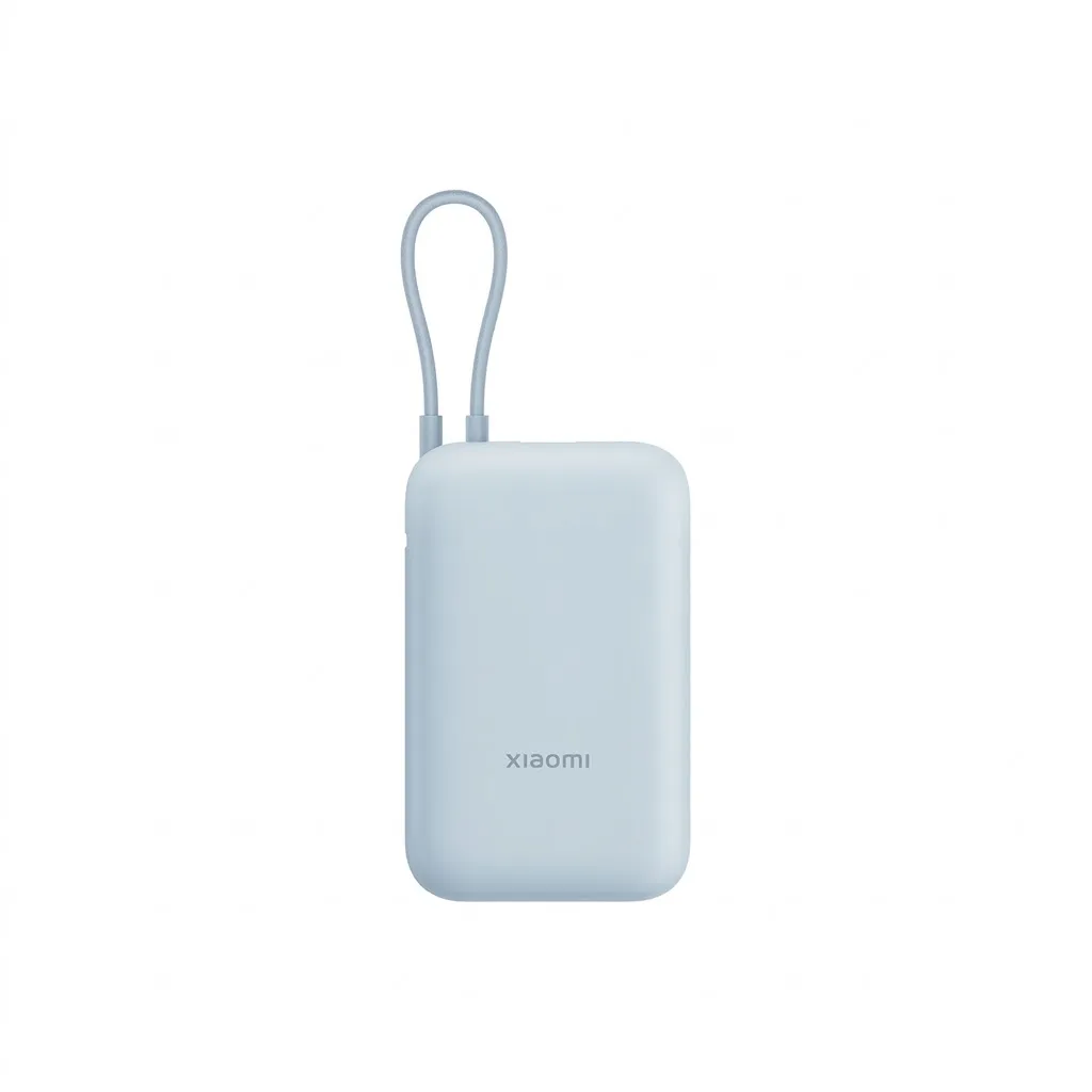 Compact Xiaomi Power Bank 10000mAh resting beside an air travel passport