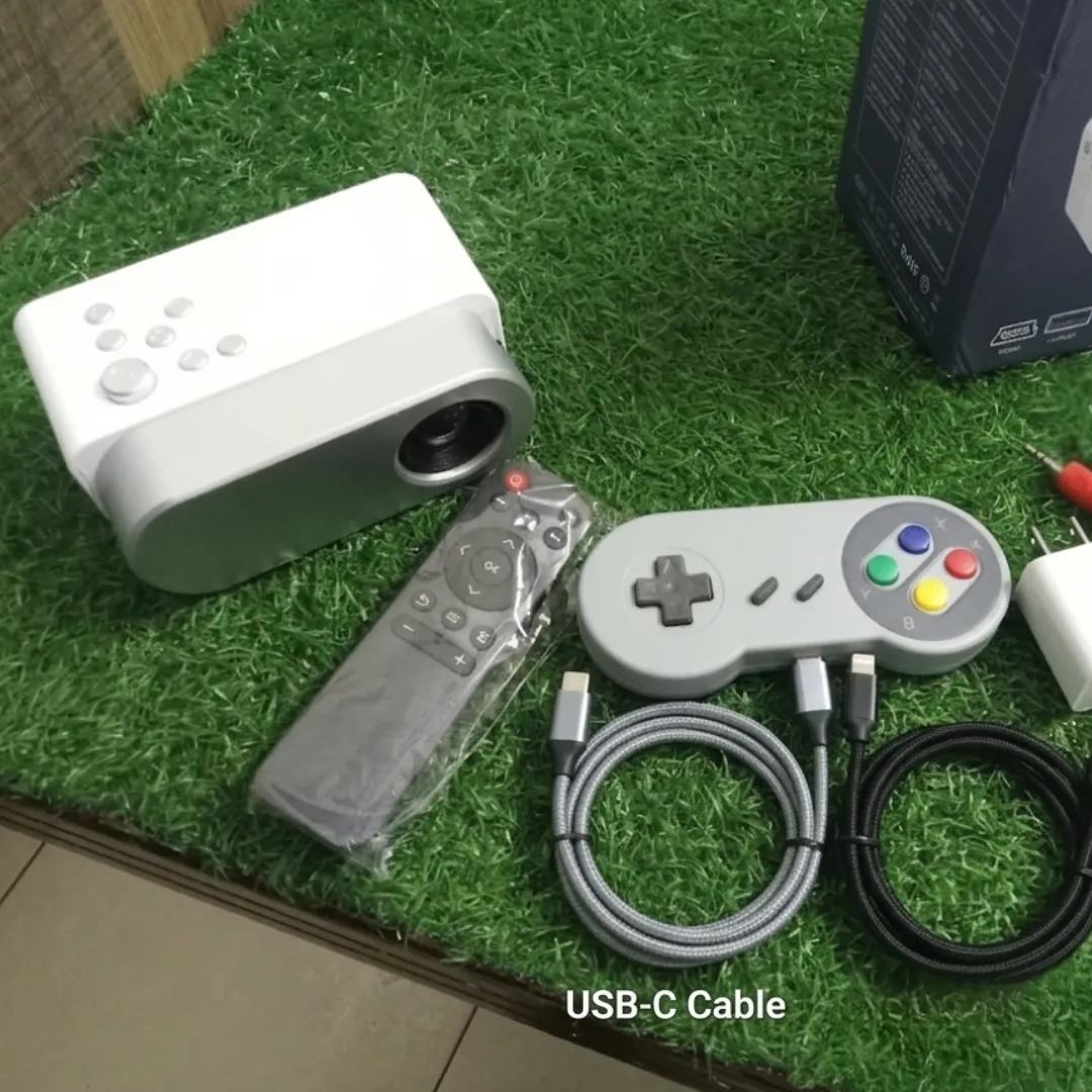 Close-up of the Mini Projector gaming controller and power cables.