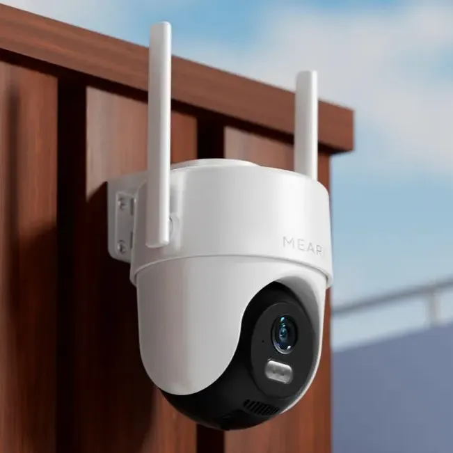 Meari S2 outdoor PTZ camera mounted on tree trunk showcasing IP65 waterproof design
