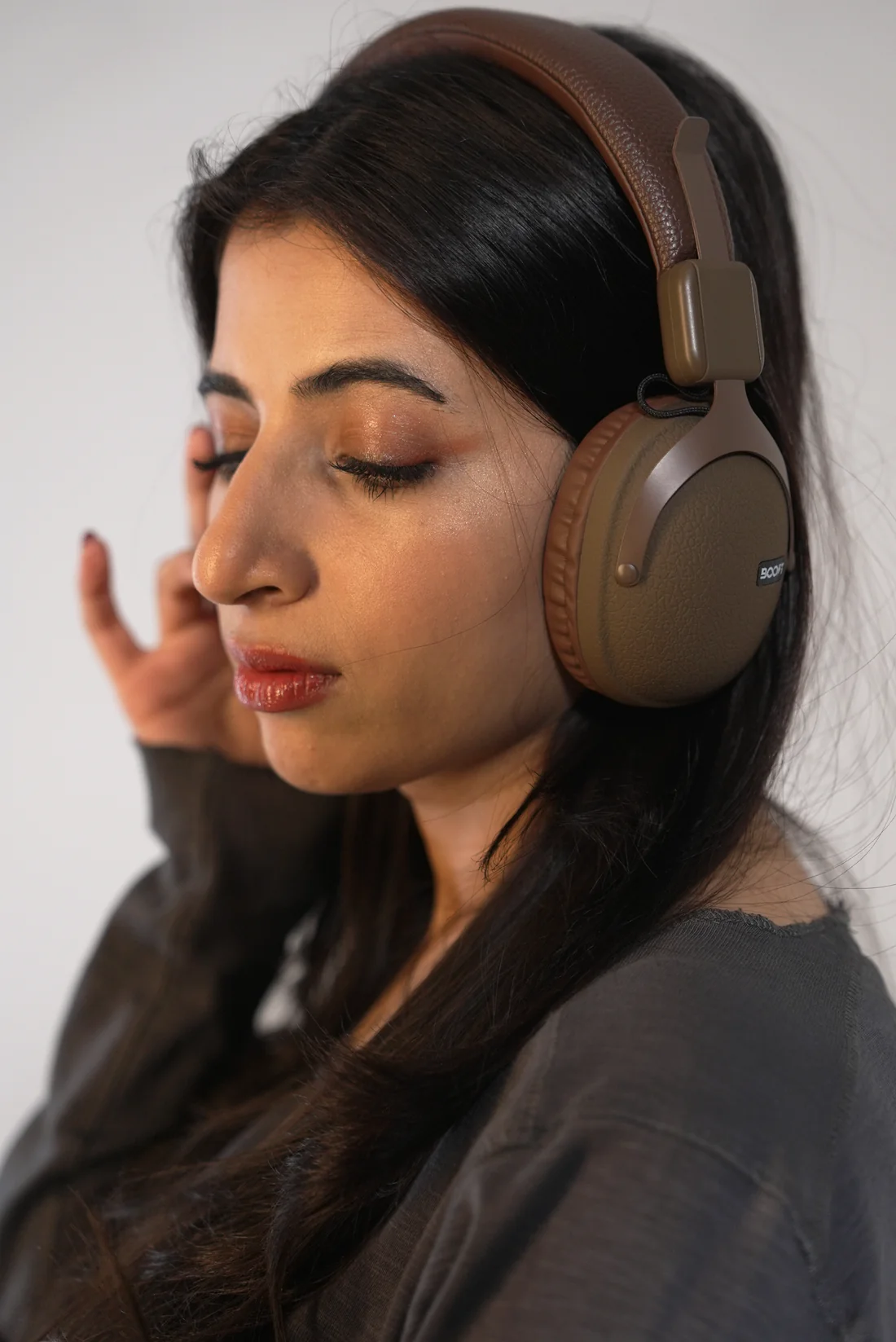 Side view of Boost Note retro wireless headset showing cushioned headband detail in Brown