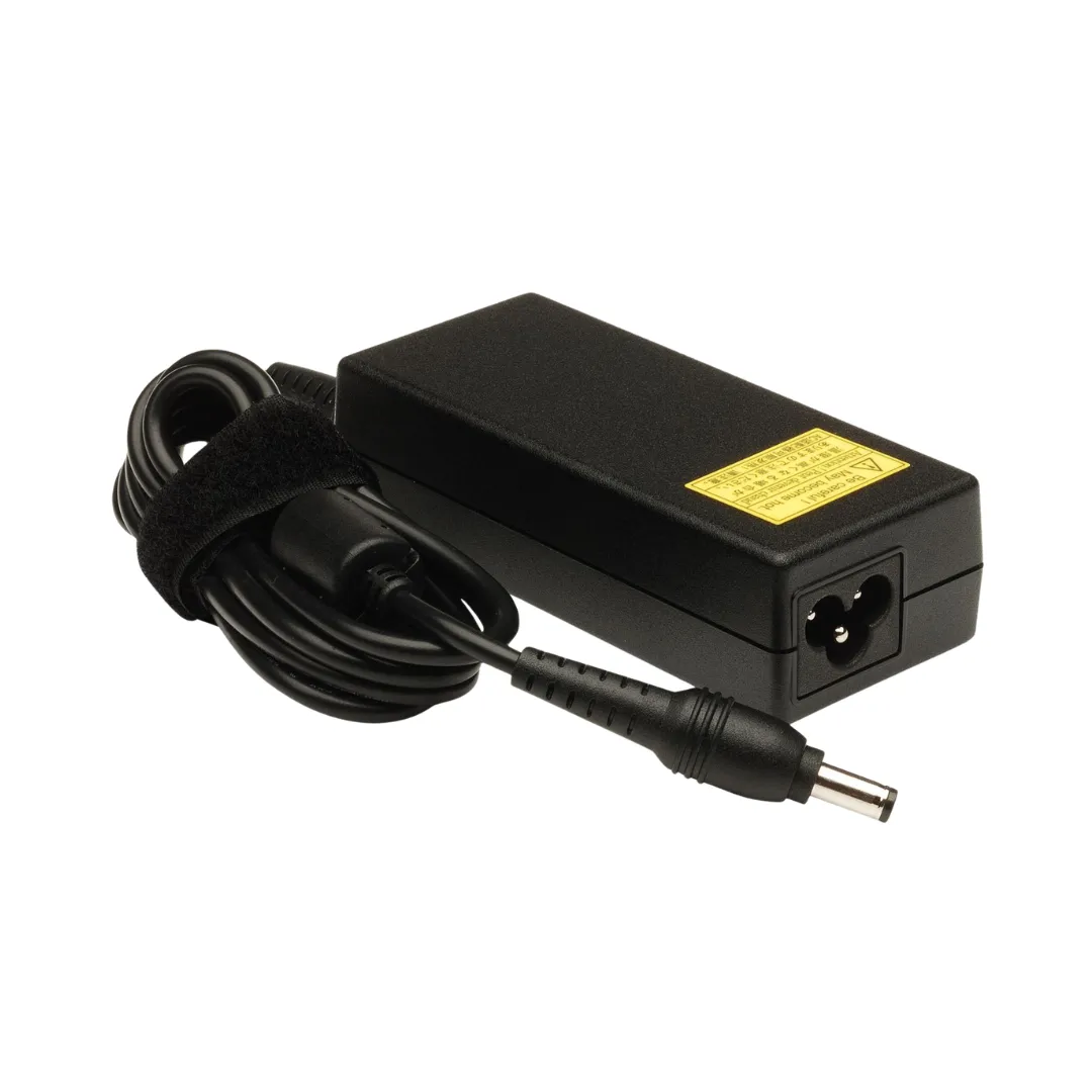 Close-up view of the 5.5mm x 2.5mm standard round barrel connector tip of the 65W laptop adapter.