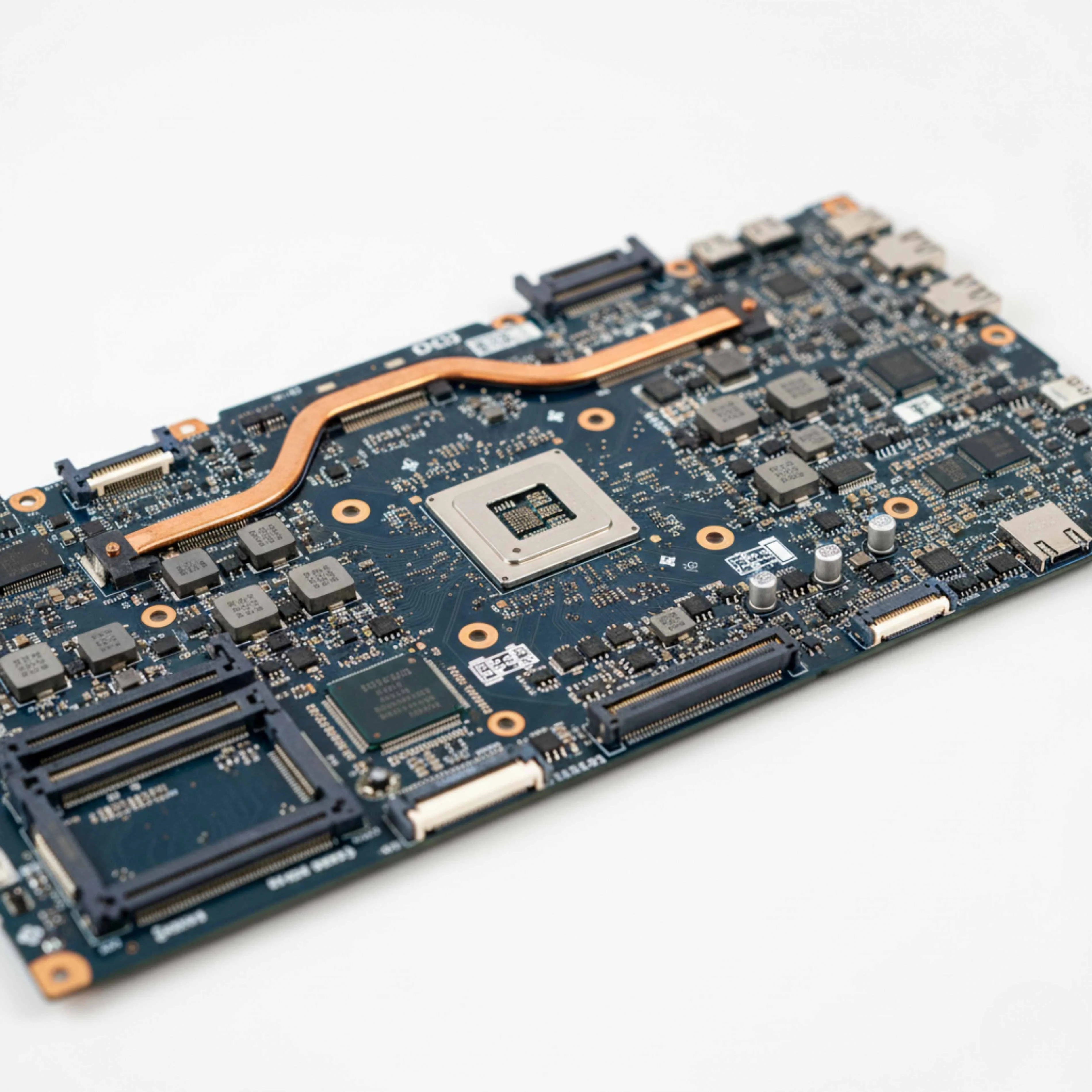 Close-up of laptop internal cleaning and thermal paste application for overheating issues.