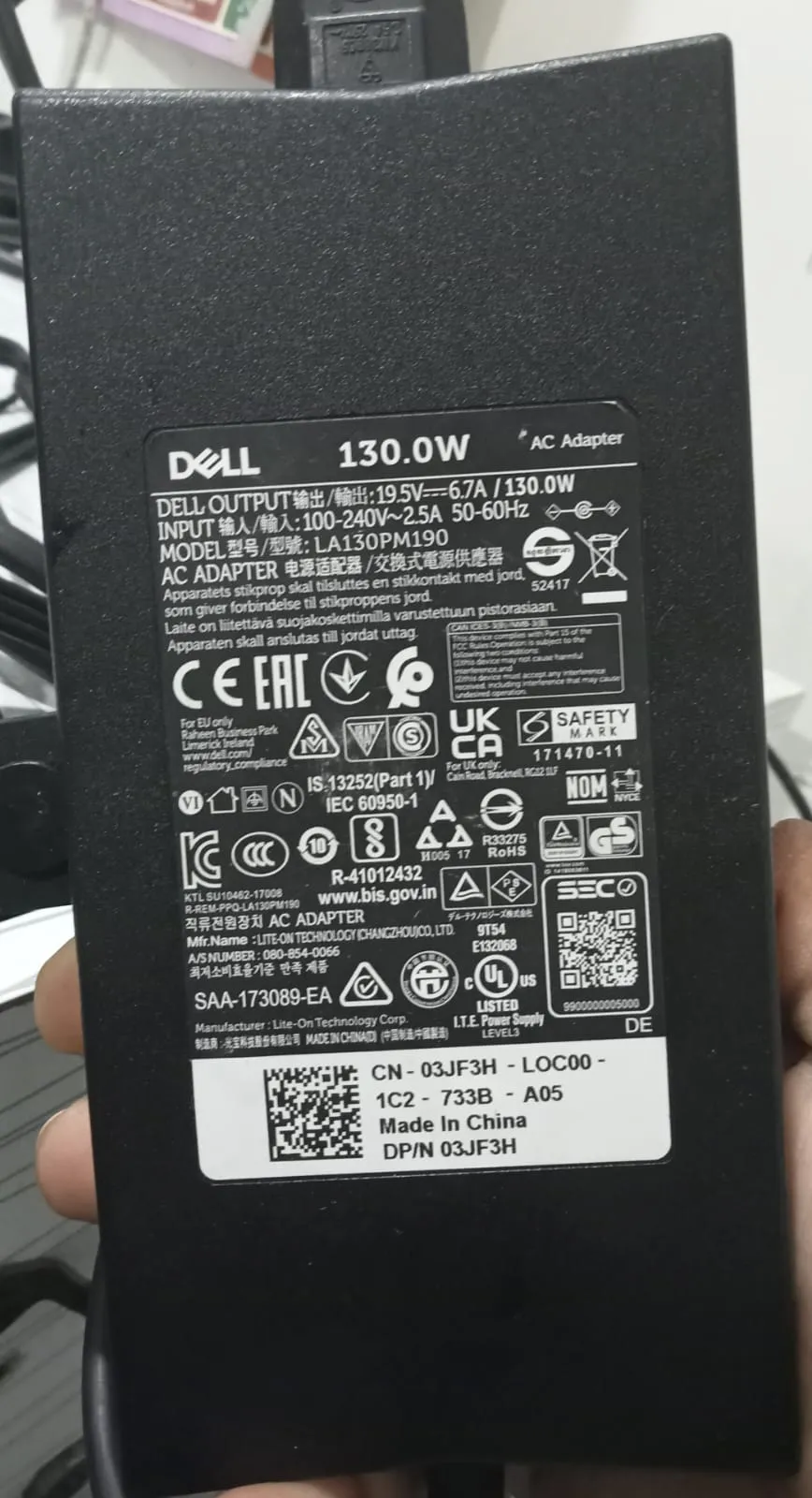 Dell E-Port docking station and a Latitude laptop connected seamlessly to an original Dell 130W power source from IT Repair Hub.