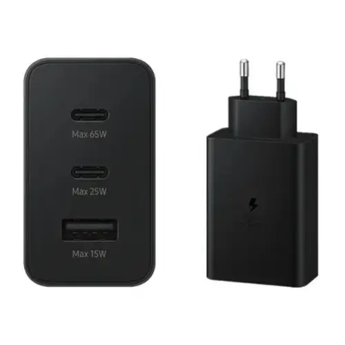 65W PD wall adapter charging a laptop and smartphone simultaneously on an office desk