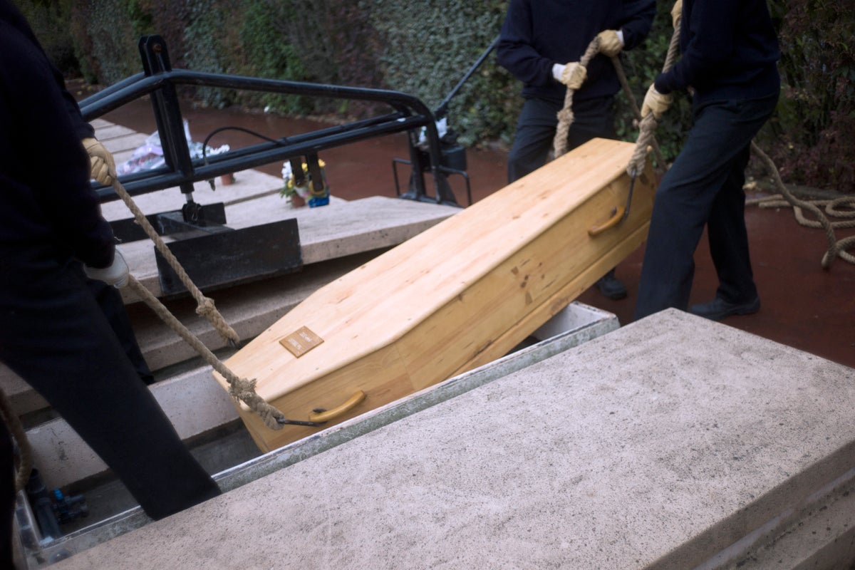 Widow Sues After Husband's Body Falls From Casket