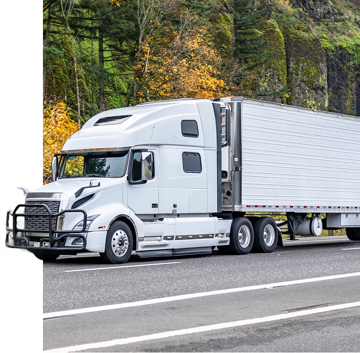 Semi trucks transporting shipping containers on a highway