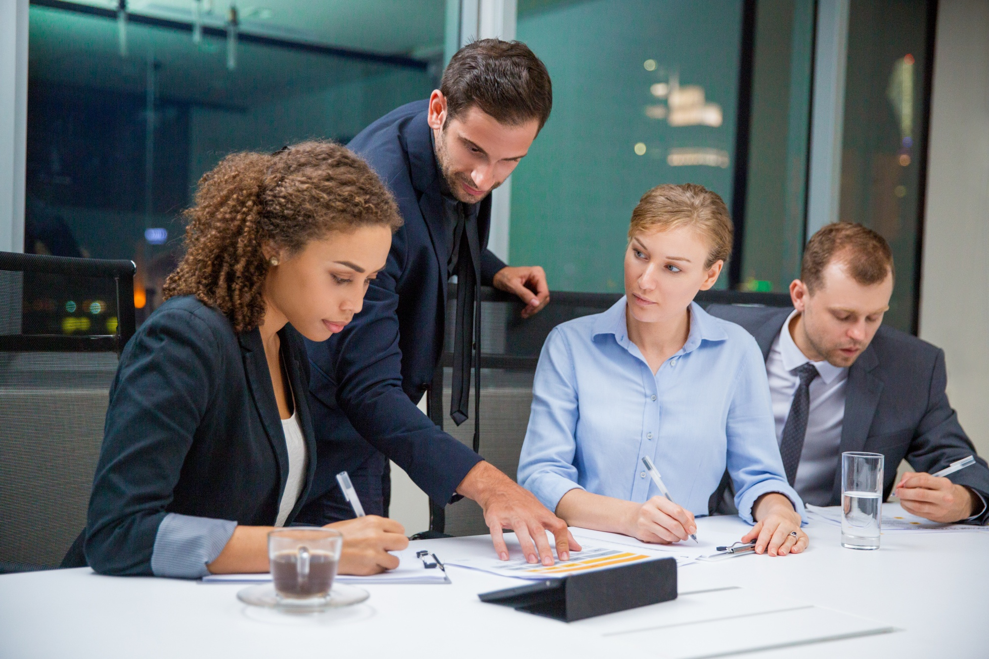 Accounting team reviewing documents together in a meeting