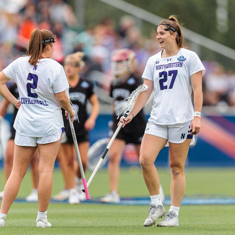 Izzy and Erin playing lacrosse