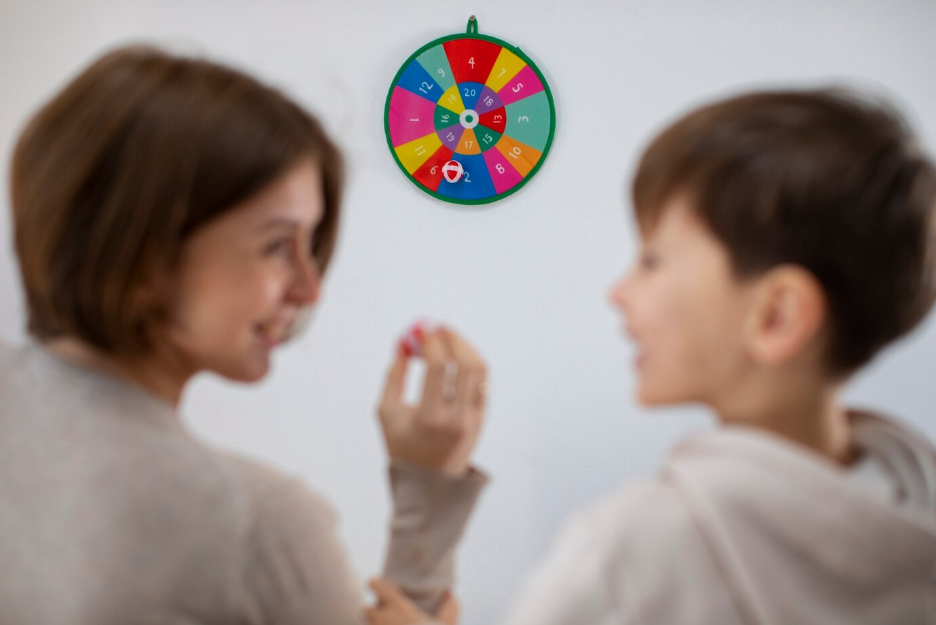 A young child looking at a vision board with a parent, setting career and education goals with colorful sticky notes.