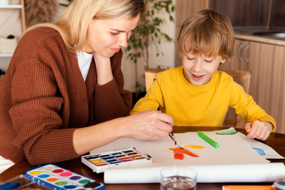 A parent helping their child with homework at home, with drawings on the table.